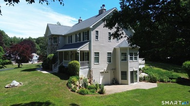 Situated on over an acre of manicured grounds, this custom-built - photo 2