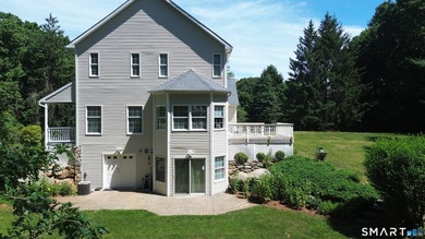 Situated on over an acre of manicured grounds, this custom-built - photo 3