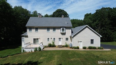 Situated on over an acre of manicured grounds, this custom-built - photo 4