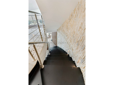 Perched on the 55th floor of the prestigious Trump Royale, this - photo 26