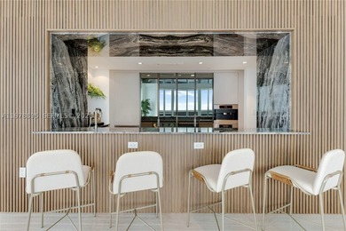 Perched on the 55th floor of the prestigious Trump Royale, this - photo 32