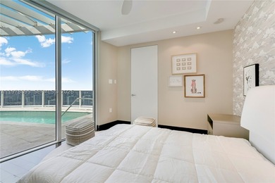 Perched on the 55th floor of the prestigious Trump Royale, this - photo 49