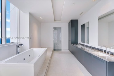 Perched on the 55th floor of the prestigious Trump Royale, this - photo 52