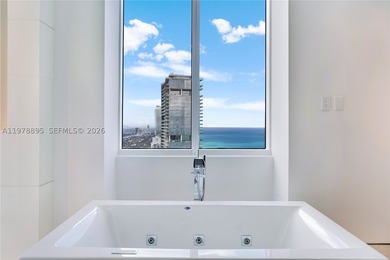 Perched on the 55th floor of the prestigious Trump Royale, this - photo 55