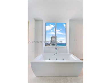 Perched on the 55th floor of the prestigious Trump Royale, this - photo 56
