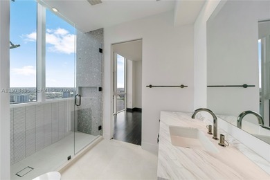 Perched on the 55th floor of the prestigious Trump Royale, this - photo 59