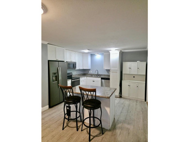 This lovely home offers 3 bedrooms and 2 baths, with a welcoming - photo 4