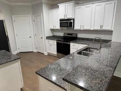 Welcome to this stunning 3-bedroom, 2-bath home with a dedicated - photo 6