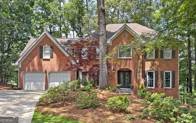 WELCOME HOME to this 4 bed, 3.5 bath golf-side brick-front - photo 1