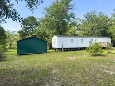 Looking for room to breathe? This 2006 Cavalier single-wide sits - photo 2