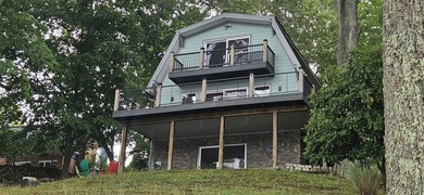 Welcoming covered front porch w/ composite decking & lake views - photo 11