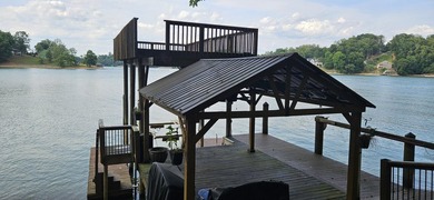 Welcoming covered front porch w/ composite decking & lake views - photo 12