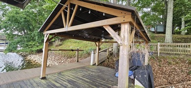 Welcoming covered front porch w/ composite decking & lake views - photo 13