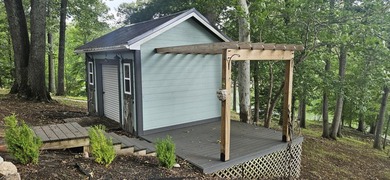 Welcoming covered front porch w/ composite decking & lake views - photo 15