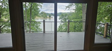 Welcoming covered front porch w/ composite decking & lake views - photo 40
