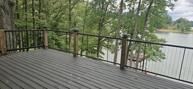 Welcoming covered front porch w/ composite decking & lake views - photo 41