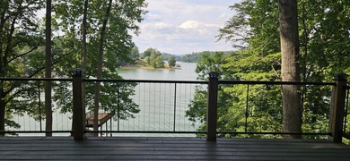 Welcoming covered front porch w/ composite decking & lake views - photo 42