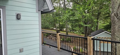 Welcoming covered front porch w/ composite decking & lake views - photo 45