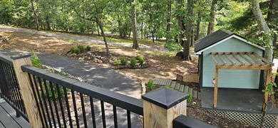 Welcoming covered front porch w/ composite decking & lake views - photo 46