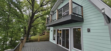 Welcoming covered front porch w/ composite decking & lake views - photo 47