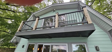 Welcoming covered front porch w/ composite decking & lake views - photo 48