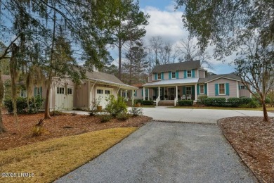 This home boasts a spacious screened back porch that provides a - Lake Home For Sale in Bluffton, South Carolina