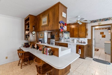 This home features a double lot and an oversized garage so you