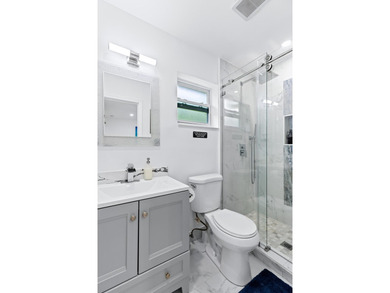 Welcome to this ultra-modern 3-bedroom, 2-bathroom single-story - photo 19