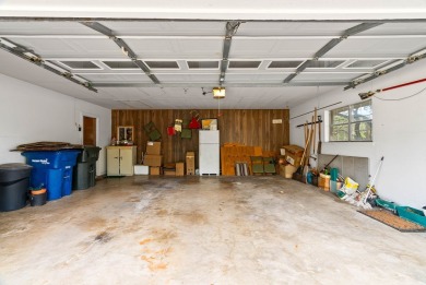 This home features a double lot and an oversized garage so you