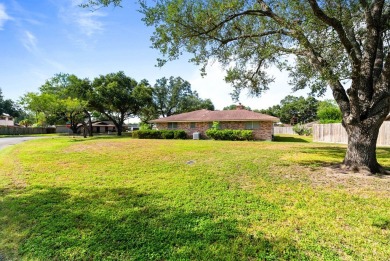 This home features a double lot and an oversized garage so you