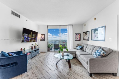 Located on a high floor of Metropolis II, Unit 908 offers a