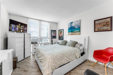 Located on a high floor of Metropolis II, Unit 908 offers a