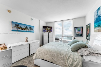 Located on a high floor of Metropolis II, Unit 908 offers a