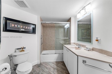 Located on a high floor of Metropolis II, Unit 908 offers a