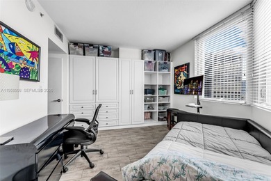 Located on a high floor of Metropolis II, Unit 908 offers a
