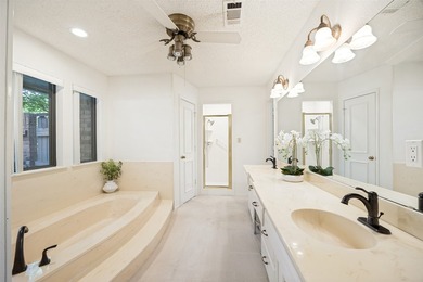 Nestled on a picturesque golf course lot in Richardson, this - photo 15
