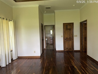 Set on 1.48 wooded acres along Lake Limestone, this custom stone - photo 15