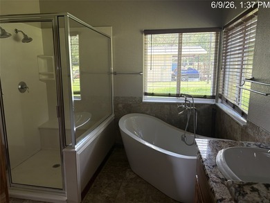 Set on 1.48 wooded acres along Lake Limestone, this custom stone - photo 18