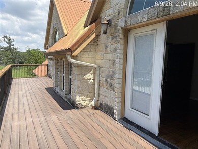 Set on 1.48 wooded acres along Lake Limestone, this custom stone - photo 32
