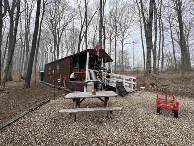 Nestled at the end of a quiet lane on 2 private acres, this