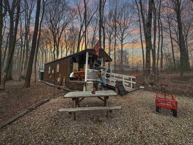 Nestled at the end of a quiet lane on 2 private acres, this