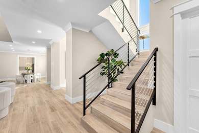 Newly completed in 2025, this exceptional oceanfront estate is