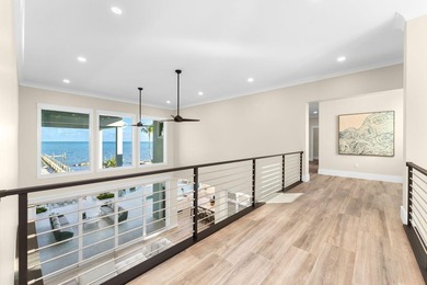 Newly completed in 2025, this exceptional oceanfront estate is