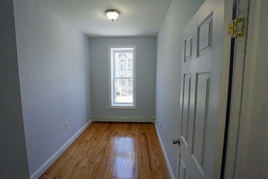 This well-maintained legal two-family, 6 bedroom, 3 bath brick - photo 12