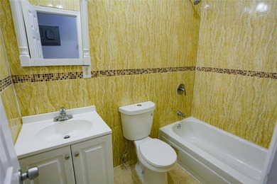 This well-maintained legal two-family, 6 bedroom, 3 bath brick - photo 13