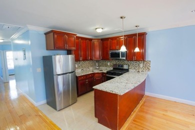 This well-maintained legal two-family, 6 bedroom, 3 bath brick - photo 15