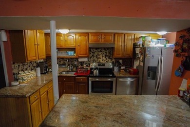 This well-maintained legal two-family, 6 bedroom, 3 bath brick - photo 24