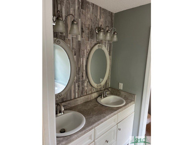 This charming 3-bedroom, 2-bathroom home is situated on a - photo 15