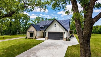 Experience luxury lake living in this stunning new construction - photo 34