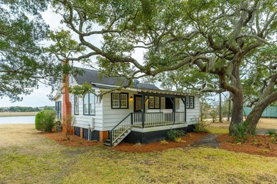 Tucked beneath a canopy of majestic live oaks along the serene - photo 40
